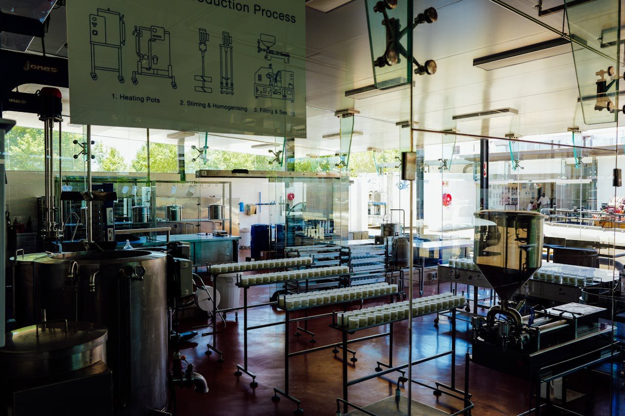 Home Spacious and modern food production plant interior with industrial machinery and processing line.